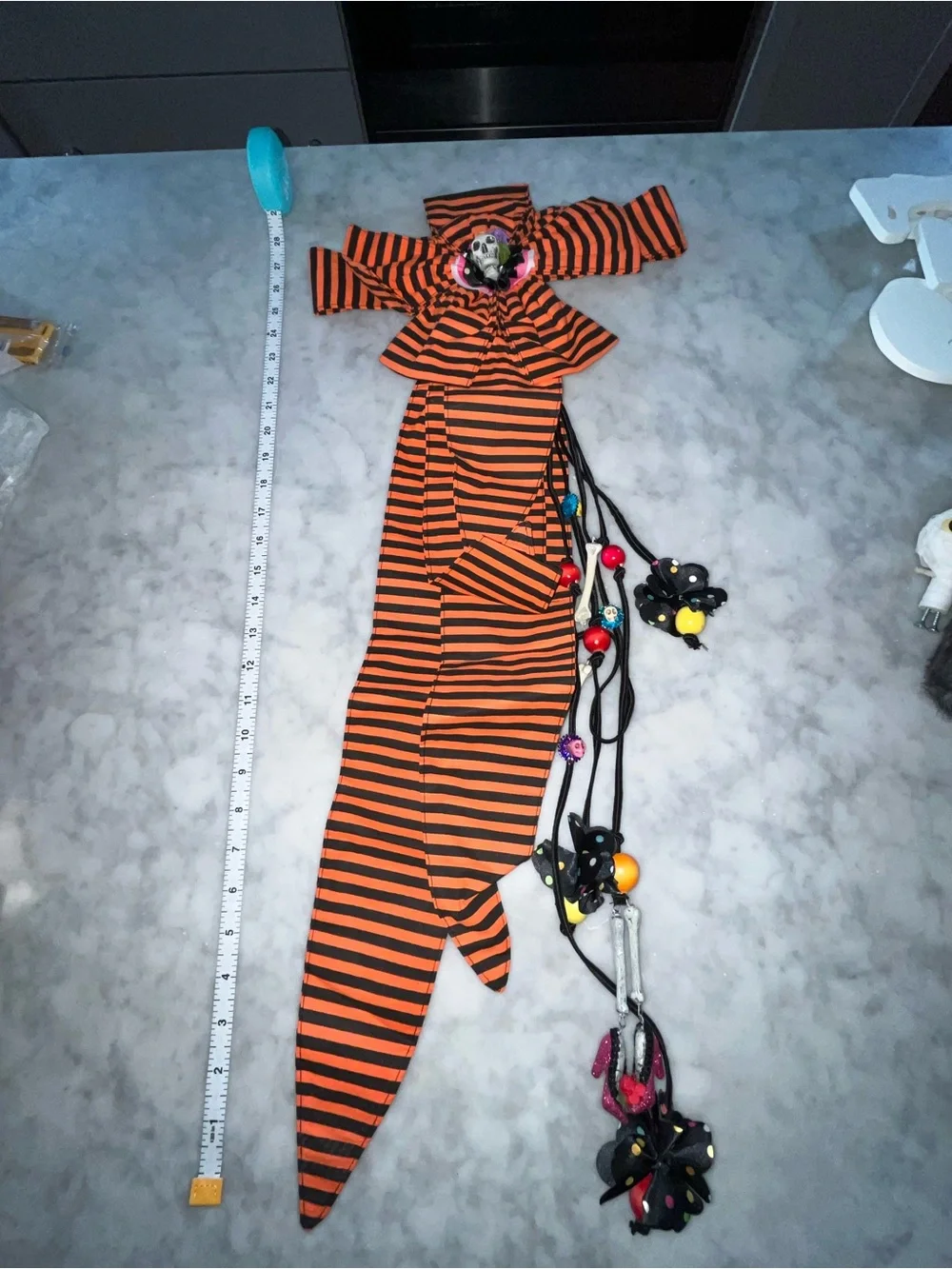 Orange and Black Striped Bow Belt Accent with Decorative Skull